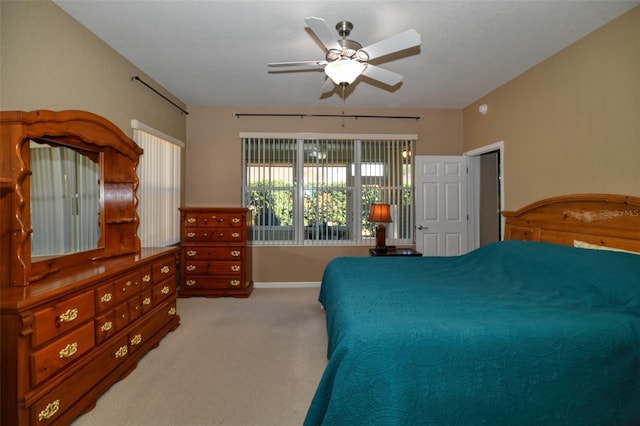 bedroom with ceiling fan and carpet