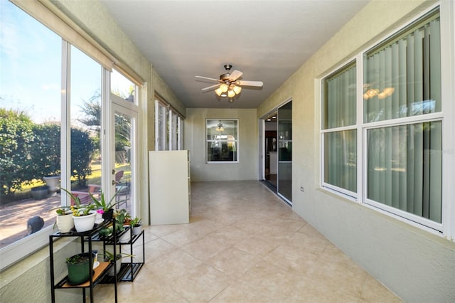 sunroom / solarium with ceiling fan