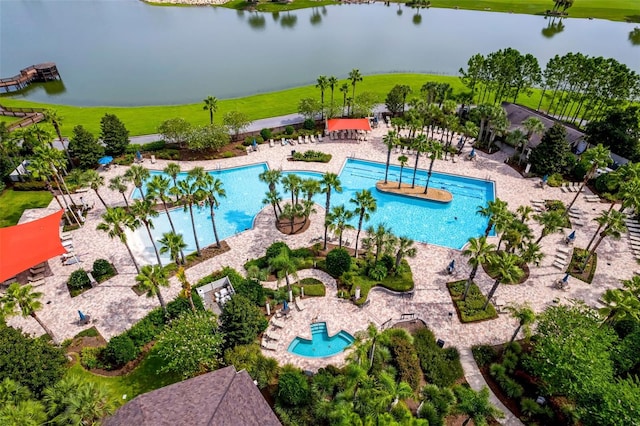 view of swimming pool featuring a water view