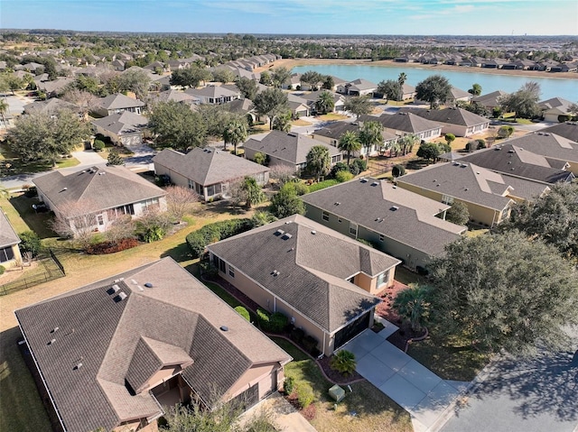 aerial view featuring a residential view and a water view