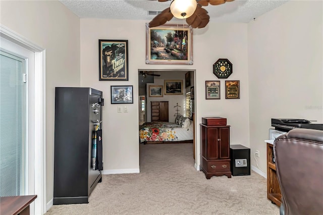 interior space featuring a textured ceiling and ceiling fan