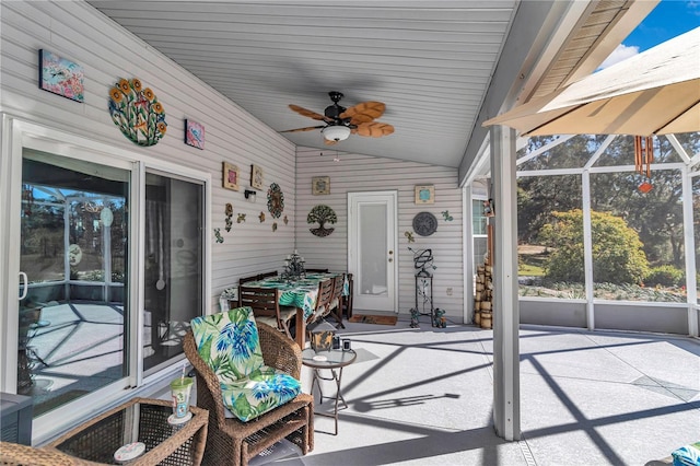 sunroom with vaulted ceiling and ceiling fan