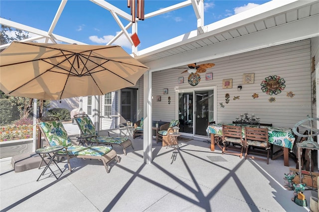 view of patio / terrace with ceiling fan and a lanai