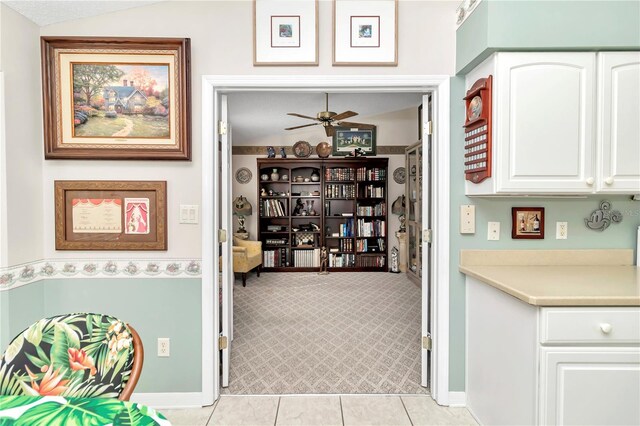 3923 Manor Oaks Ct, Leesburg, FL 34748 - hall with vaulted ceiling, light tile patterned floors, and light colored carpet