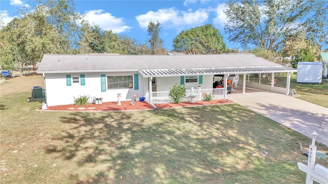 single story home featuring cooling unit, a front lawn, a carport, and a porch