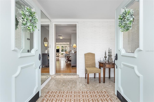 entrance foyer with brick wall