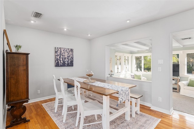 dining area featuring hardwood / wood-style floors and ceiling fan