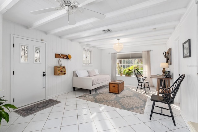 tiled foyer entrance with ceiling fan and beam ceiling