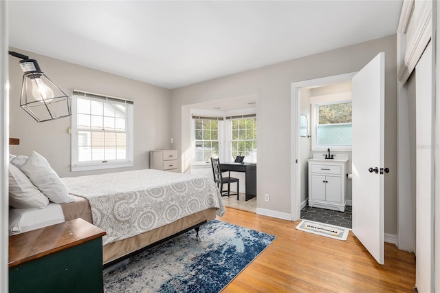 bedroom with hardwood / wood-style floors