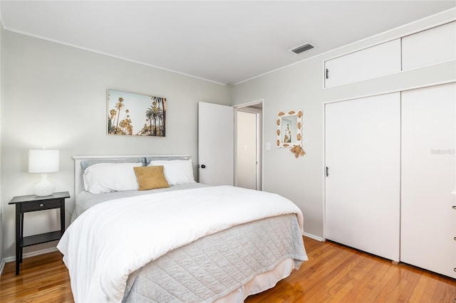 bedroom with a closet and light wood-type flooring