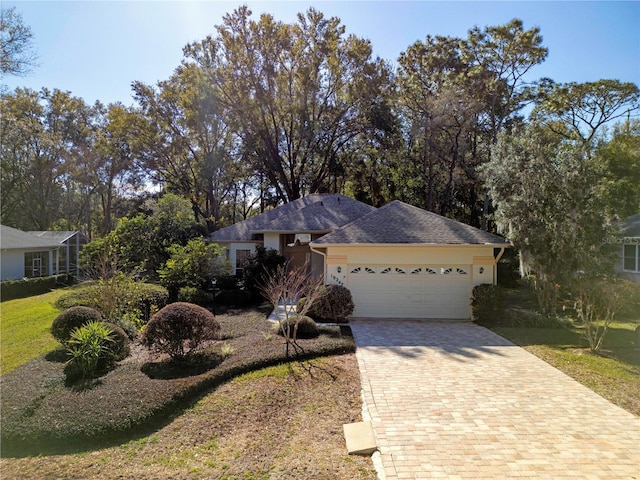 ranch-style house featuring a garage