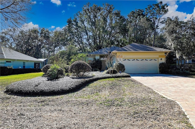 single story home featuring a garage