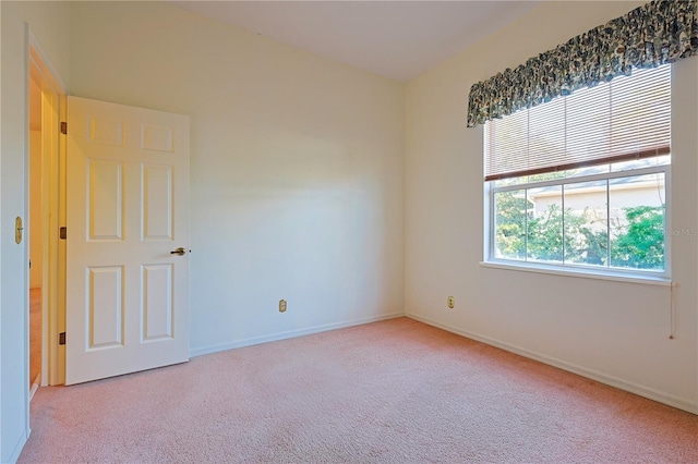 unfurnished room with light colored carpet