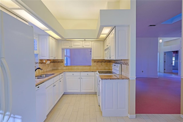 kitchen featuring white cabinetry, sink, white appliances, and decorative backsplash