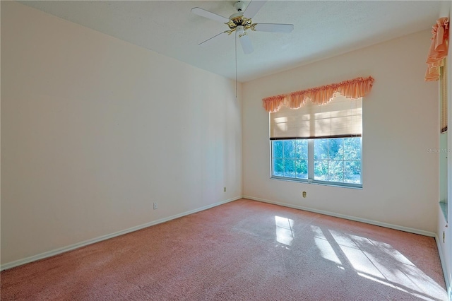 unfurnished room with light carpet and ceiling fan