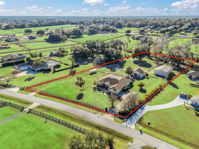 birds eye view of property featuring a rural view