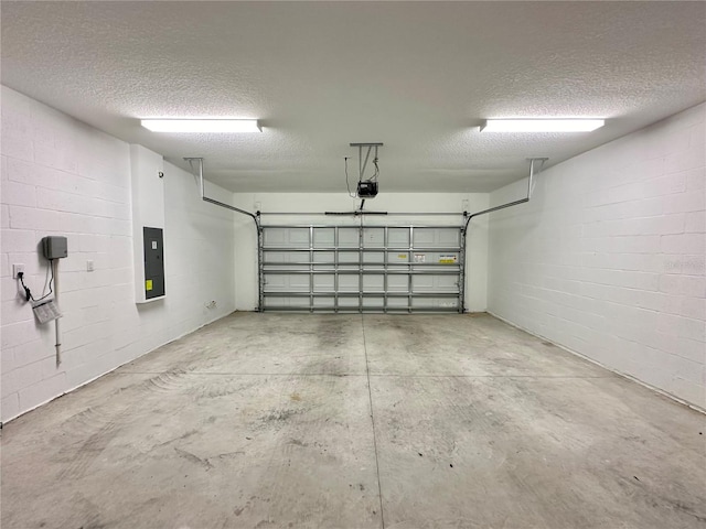 garage featuring a garage door opener and electric panel