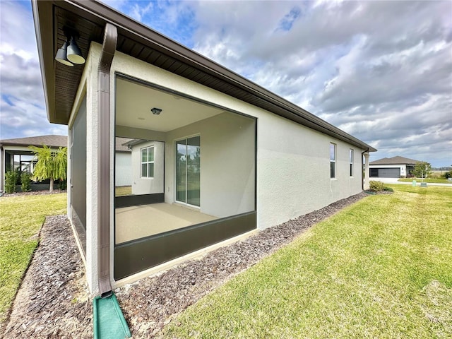 view of property exterior featuring a yard