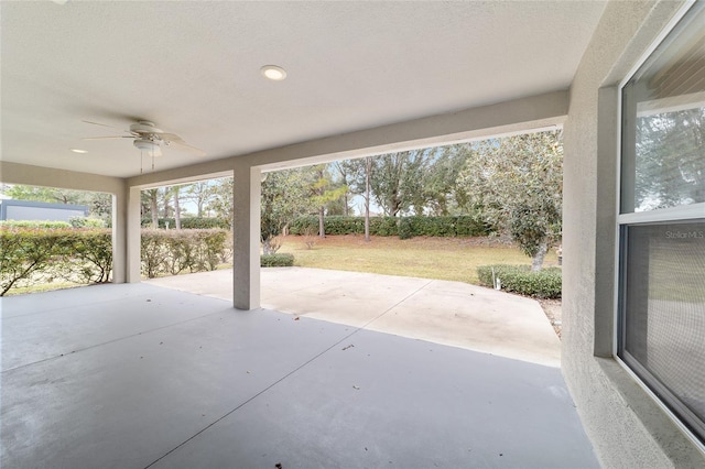 view of patio featuring ceiling fan