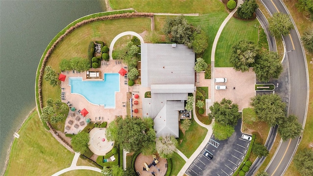 birds eye view of property with a water view