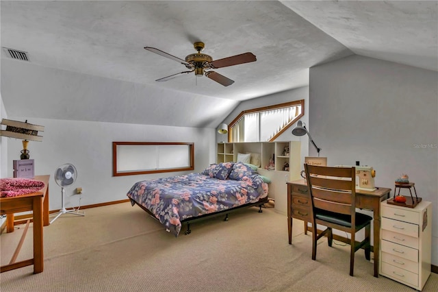 carpeted bedroom with vaulted ceiling and ceiling fan