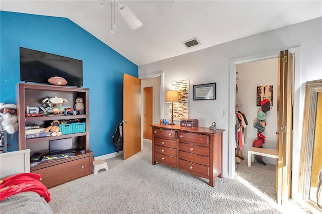 bedroom featuring light carpet, vaulted ceiling, and ceiling fan