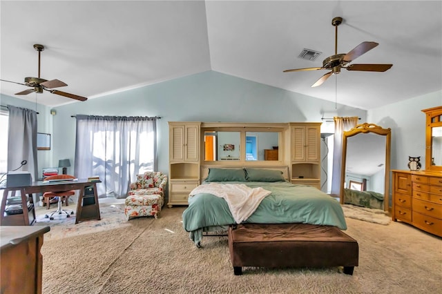 carpeted bedroom with vaulted ceiling and ceiling fan