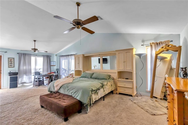 carpeted bedroom with lofted ceiling and ceiling fan