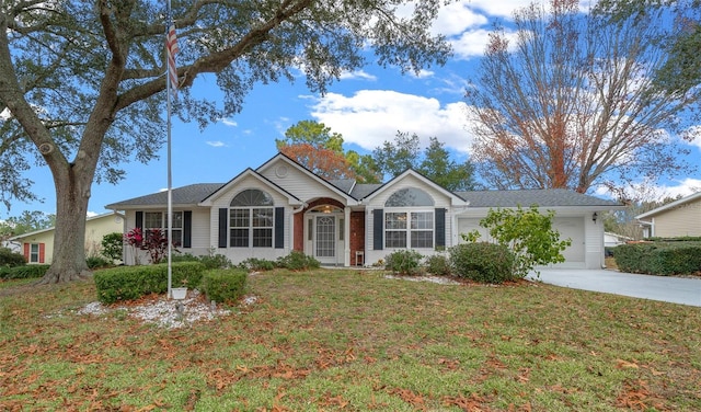 ranch-style house featuring a garage and a front lawn