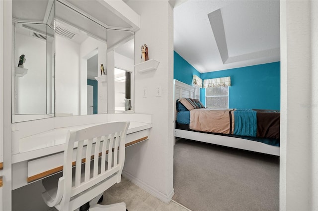 carpeted bedroom with lofted ceiling