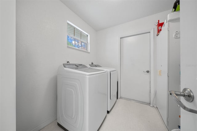 laundry area with independent washer and dryer