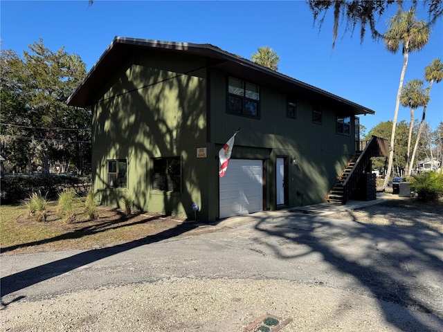 view of side of home featuring a garage