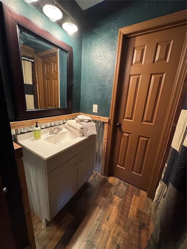 bathroom featuring wood-type flooring and vanity