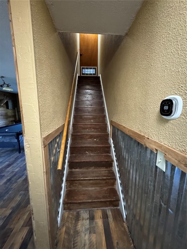 stairway featuring hardwood / wood-style flooring