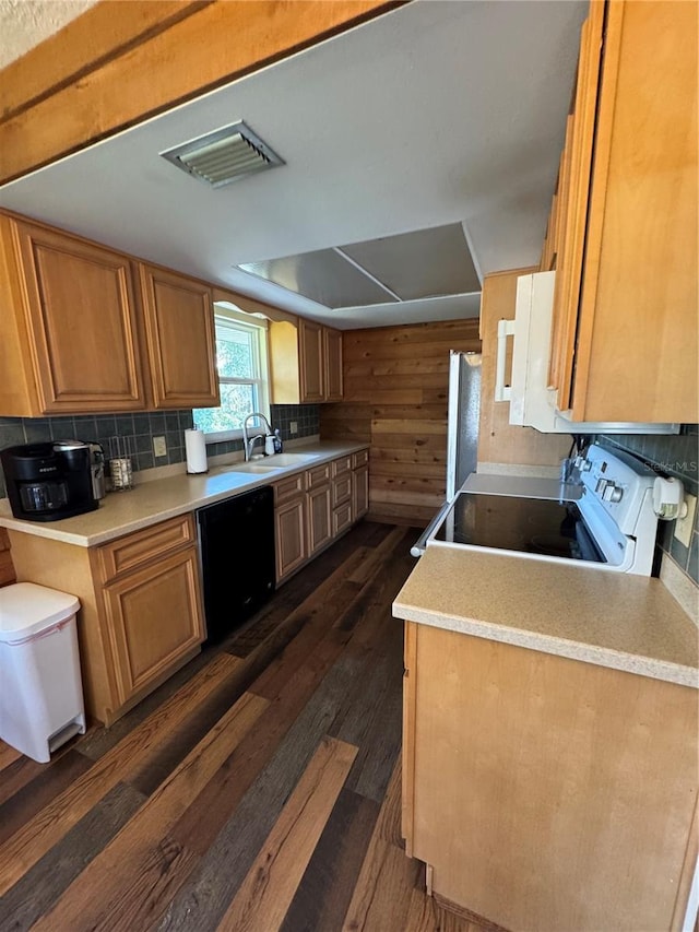 kitchen featuring stainless steel refrigerator, dishwasher, sink, white range with electric cooktop, and dark wood-type flooring