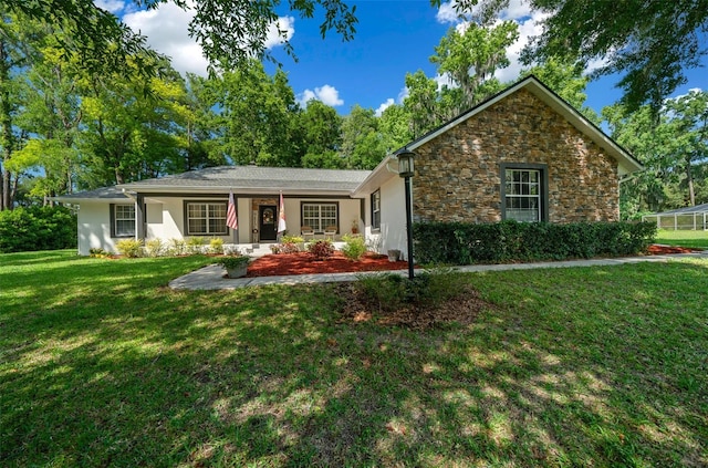 ranch-style house with a front lawn