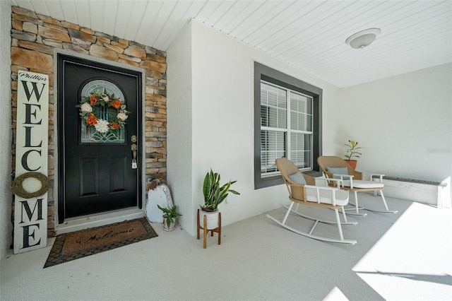 doorway to property with a porch