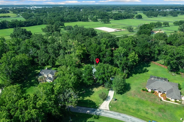 birds eye view of property with a rural view