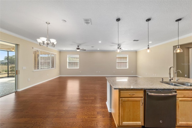 kitchen featuring dark hardwood / wood-style flooring, sink, decorative light fixtures, and stainless steel dishwasher