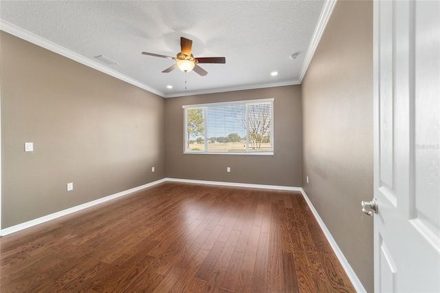 spare room featuring dark hardwood / wood-style flooring, ceiling fan, crown molding, and a textured ceiling