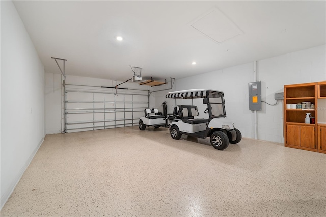 garage featuring a garage door opener and electric panel