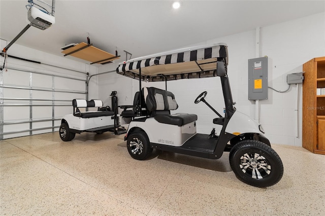 garage featuring a garage door opener and electric panel