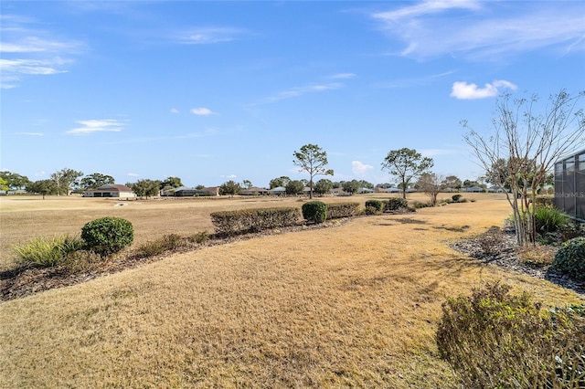 view of yard with a rural view