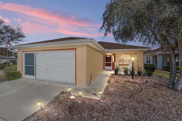 single story home featuring a garage