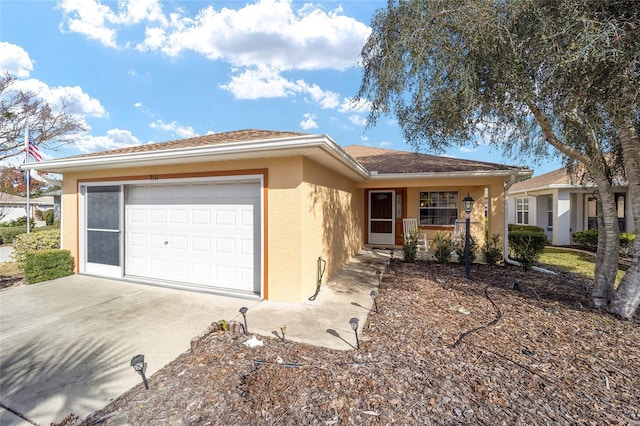 single story home featuring a porch and a garage