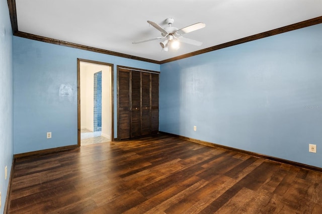 unfurnished bedroom featuring ceiling fan, ornamental molding, dark hardwood / wood-style floors, and a closet