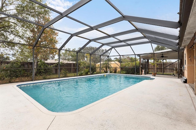 view of pool featuring a patio and glass enclosure