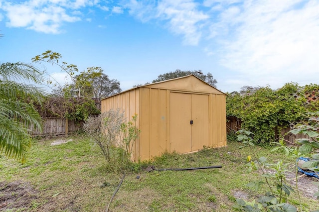 view of outbuilding featuring a yard