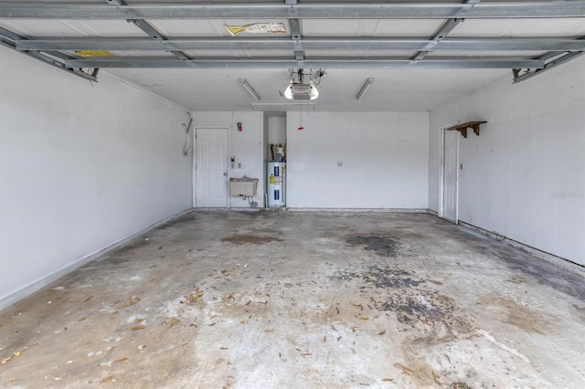 garage with a garage door opener, sink, and water heater