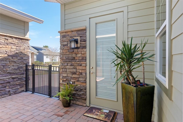 view of exterior entry with stone siding